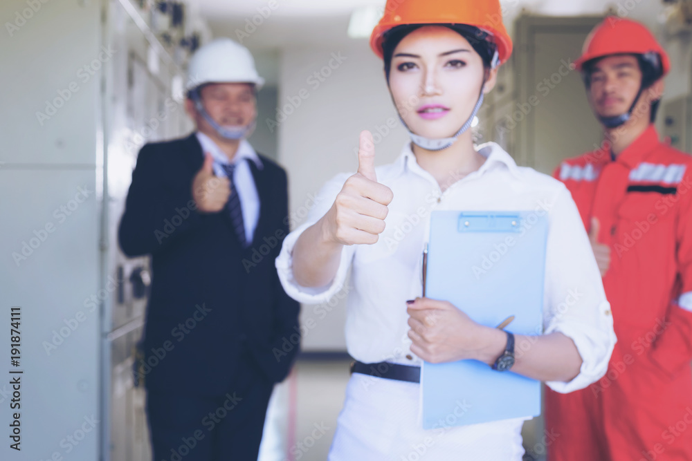 Executives and Electrical Engineers are checking the electrical equipment for their readiness. Executives and Electrical Engineers are checking the electrical equipment for their readiness.