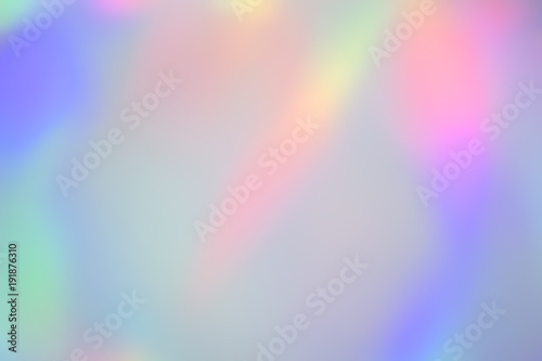 Blurry abstract pastel holographic foil background photo