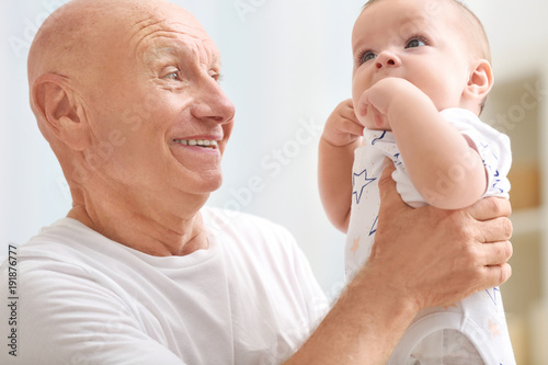 Senior man playing with his...