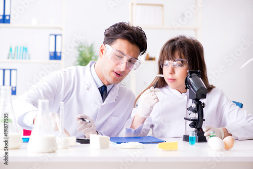 Two lab doctor testing food products