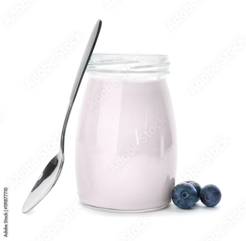 Jar with tasty yogurt and blueberry on white background