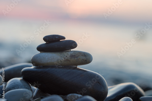 Photography stack of zen stones on pebble beach