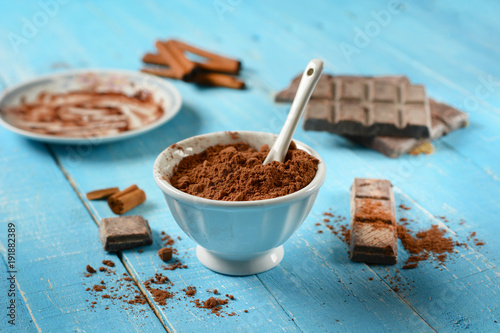 cocoa powder in the white bowl