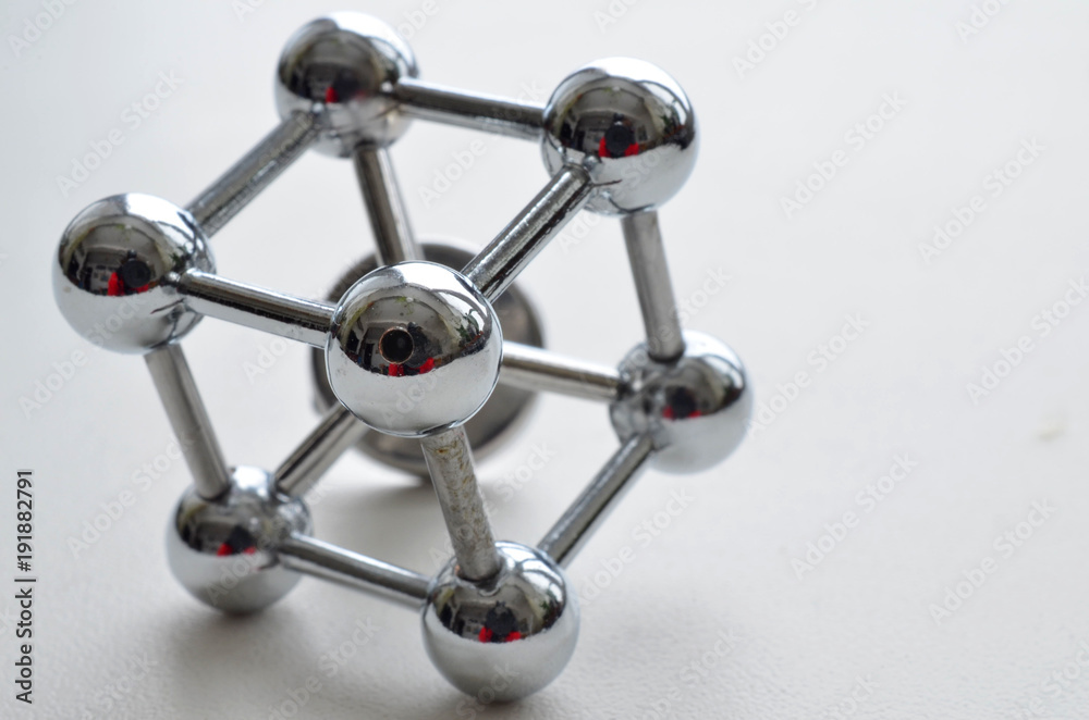 decorative image of an iron molecule made of stainless steel on a white  background Stock Photo | Adobe Stock