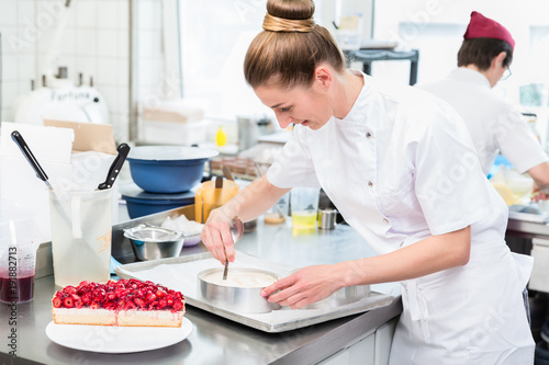 Women in pastry shop bakery making pies and cakes ready