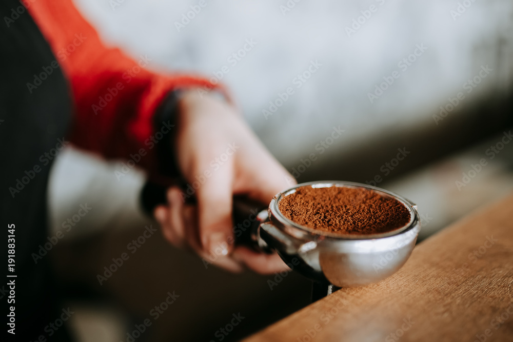 Barista is preparing making coffee with temper in hands Barista is preparing making coffee with temper in hands