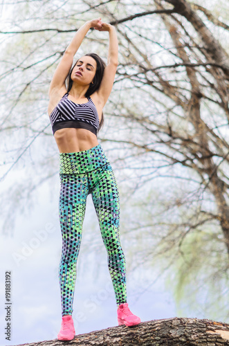 a young girl goes in for sports in the fresh air . Sports clothing pink color