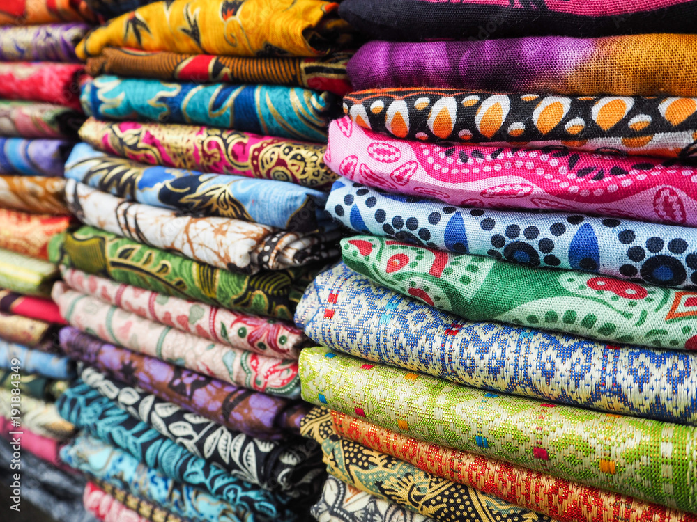 Piles of scarfs with bright colors sold in a shop in Bali, Indonesia