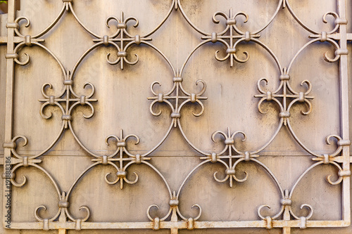 Old Decorative textured metal lattice on a wall
