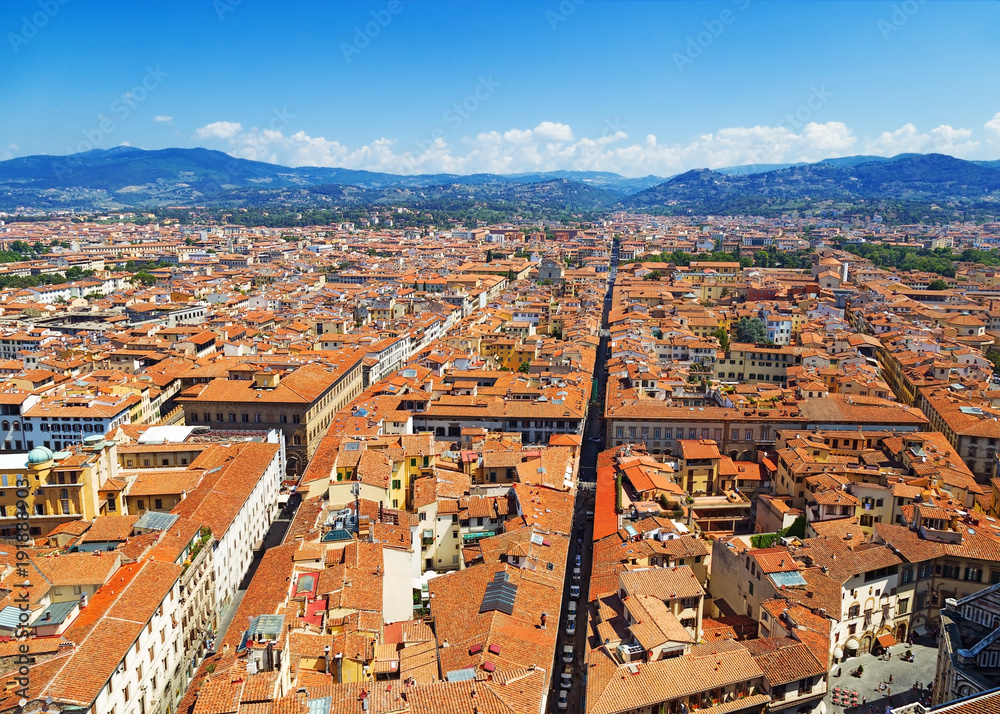 Top view of the city of Florence. Cityscape of Florence. Red roofs of city houses. Quarters of city streets from above. Italy, June 2017