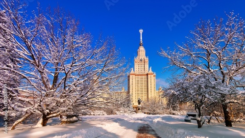 Bright wide angle view of fantastic sunny snow campus of Moscow University in winter