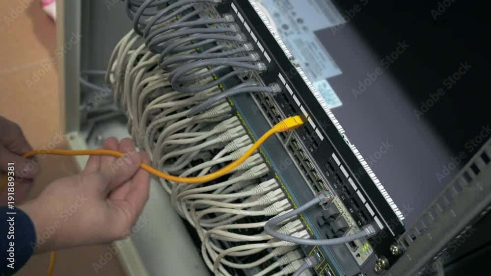 IT engineer plug in ethernet cable IT engineer plug in ethernet cable