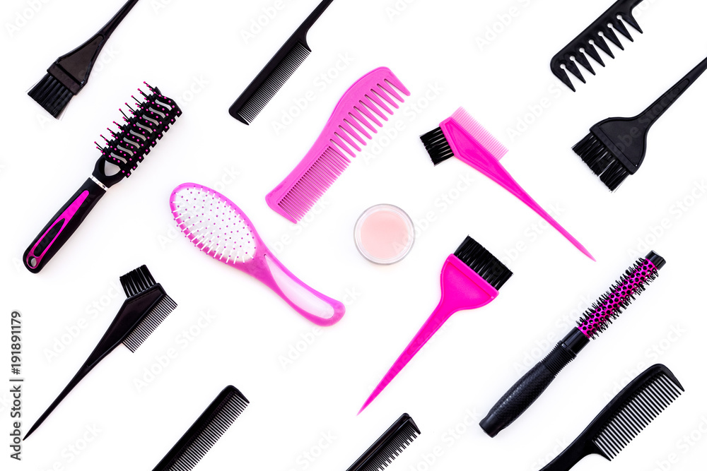 Hairdressing tools. Pattern with various combs and brushes on white background top view