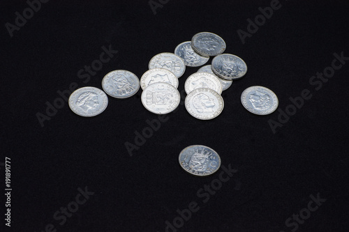 A beautiful and brillant collection of Nederlanden silver coins on black background. Closeup photo