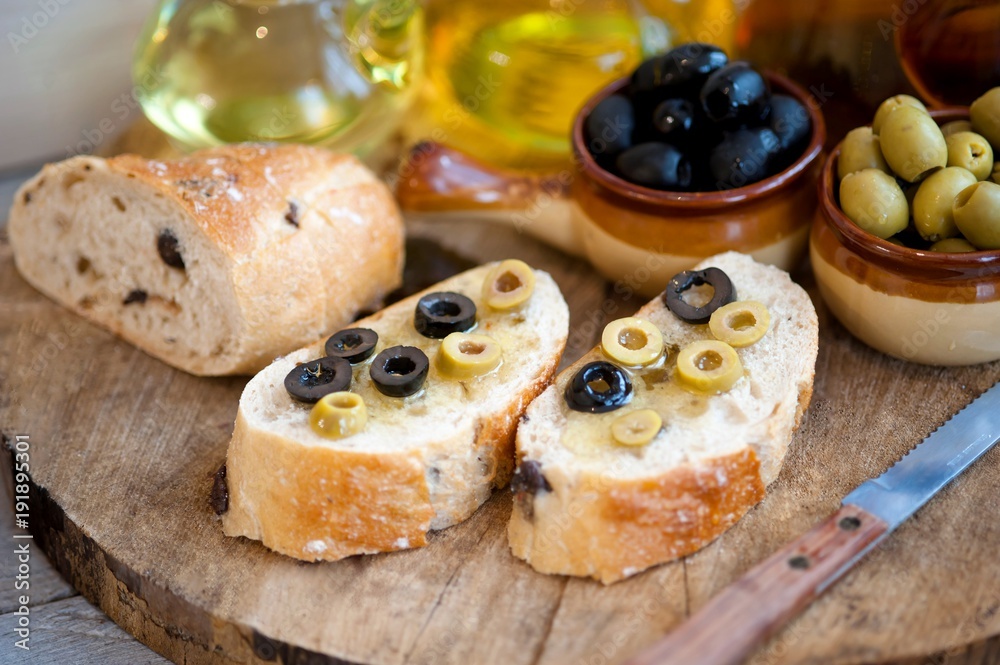 bread with olives and olive oil, olive oil in bottles bread with olives and olive oil, olive oil in bottles