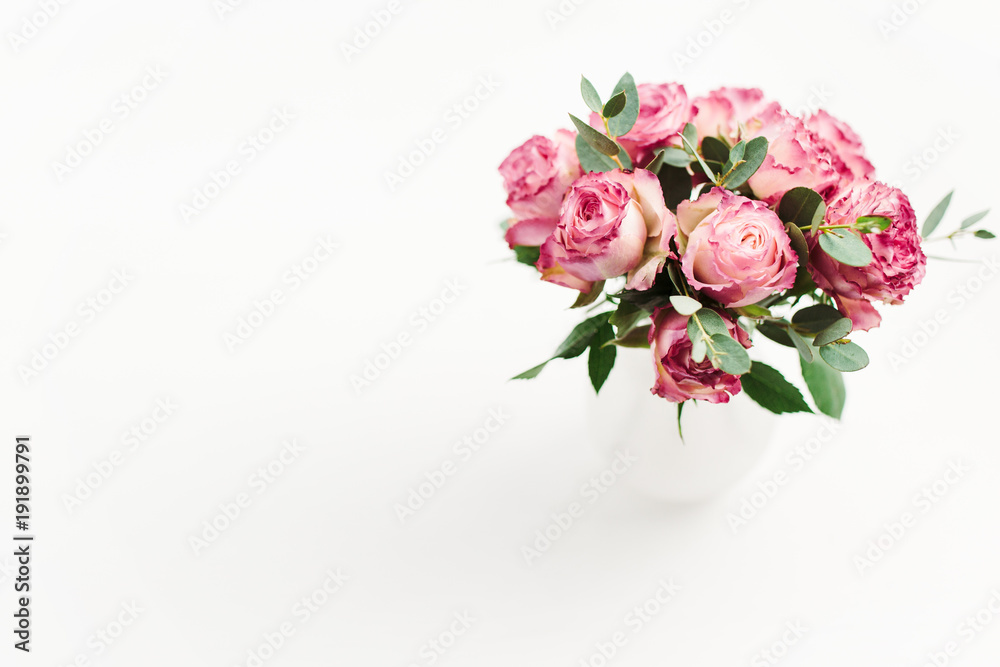 Pink rose flowers bouquet on white background. Minimal spring floral concept.