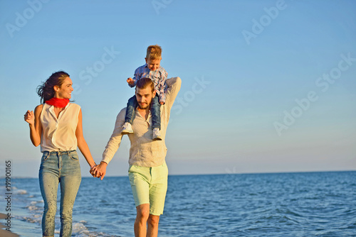 portrait of happy family and baby enjoying sunset in the summer leisure © FS-Stock