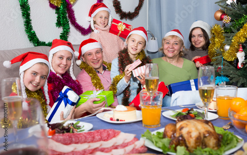 Portrait of happy family who is satisfied of presents in time celebration New Year
