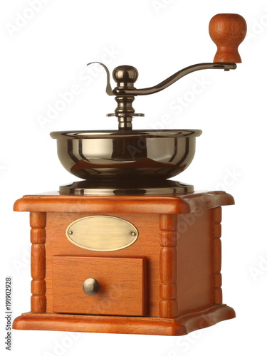 Vintage manual coffee grinder in brown wooden body