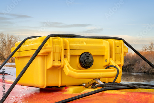 waterproof case on kayak deck
