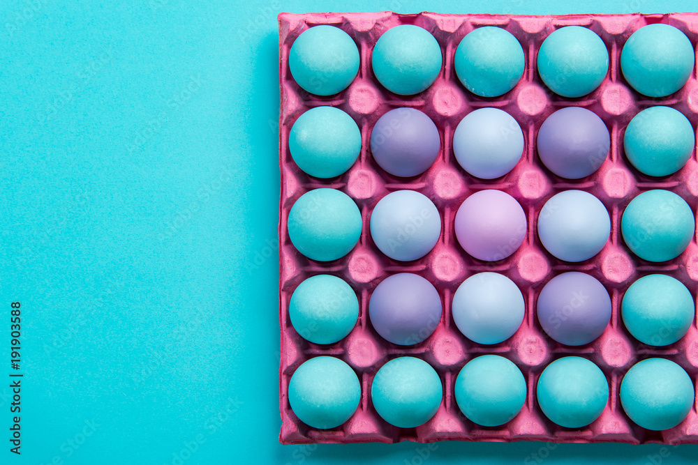 Colorful chicken eggs in tray
