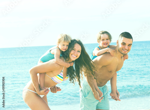 Family of four at the beach © JackF