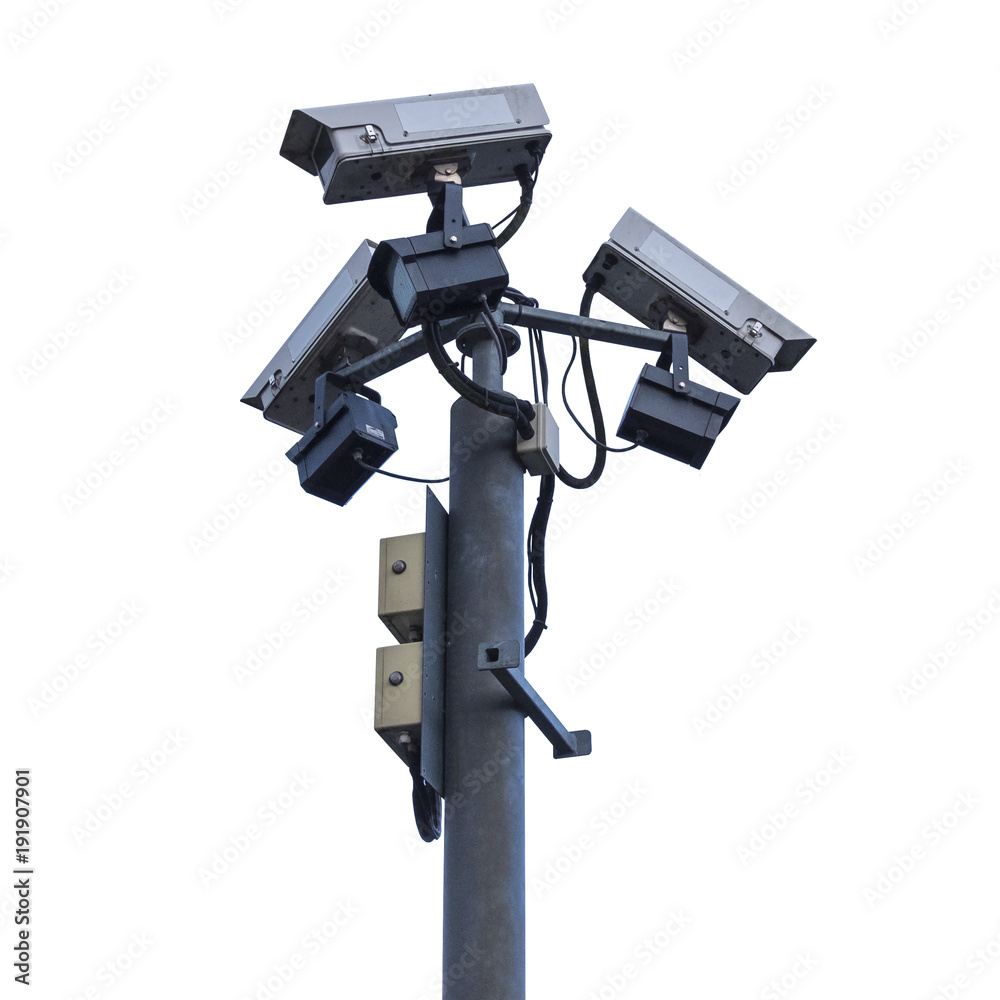 Three CCTV surveillance cameras on a pole outdoors on white background Three CCTV surveillance cameras on a pole outdoors on white background