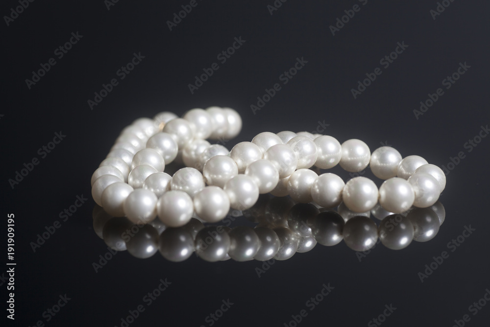 Pearl necklace on black background Pearl necklace on black background