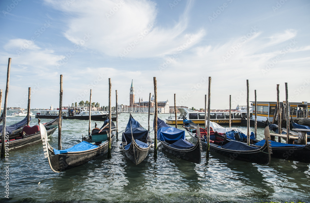 the famous gondolas in Venice moored in the lagoon
