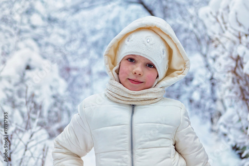 Portrait Beautiful little girl on cold winter day. place for text