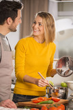 couple at home having fun cooking together