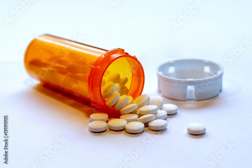 Opioid Crisis - Open Prescription Bottle of Pain Killers