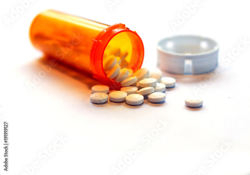 Opioid Crisis - Open Prescription Bottle of Pain Killers