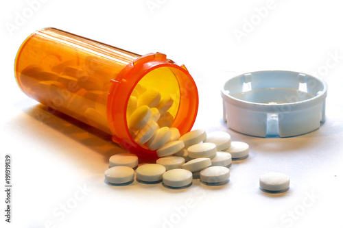 Opioid Crisis - Open Prescription Bottle of Pain Killers photo