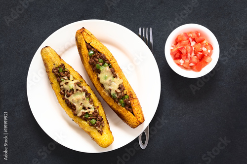 Baked ripe plantain stuffed with mincemeat, olive, green bell pepper, onion, cheese, traditional dish in Central America called Canoa de Platano (Plantain Canoe)