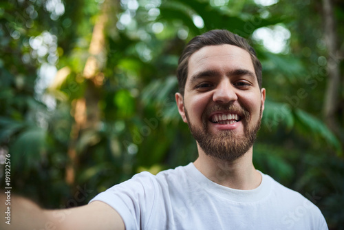 Handsome stylish bearded man in Botanical Garden