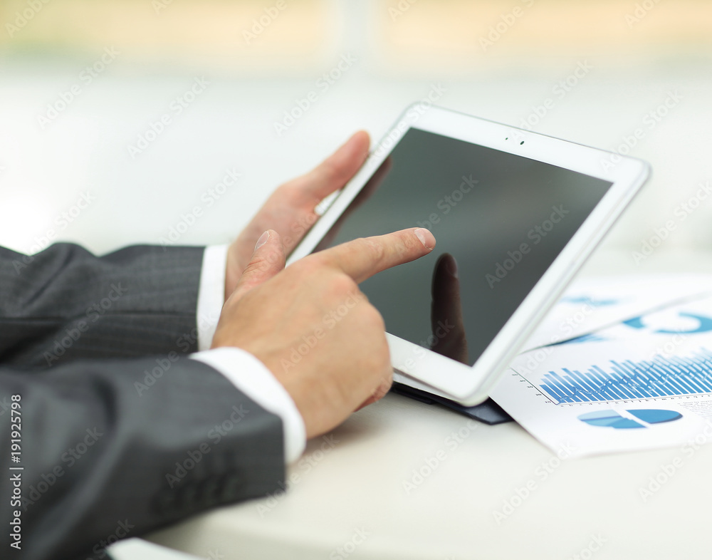 closeup.of businessman hand working with tablet computer closeup.of businessman hand working with tablet computer