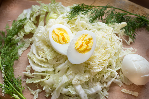 Healthy salad corn, cabbage.Eggs boiled on vegetable salad. photo