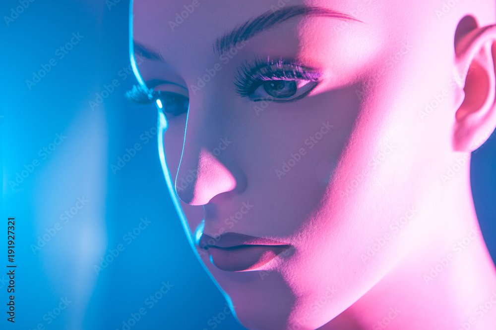 Plastic head of a woman. Mannequin woman with big eyelashes.