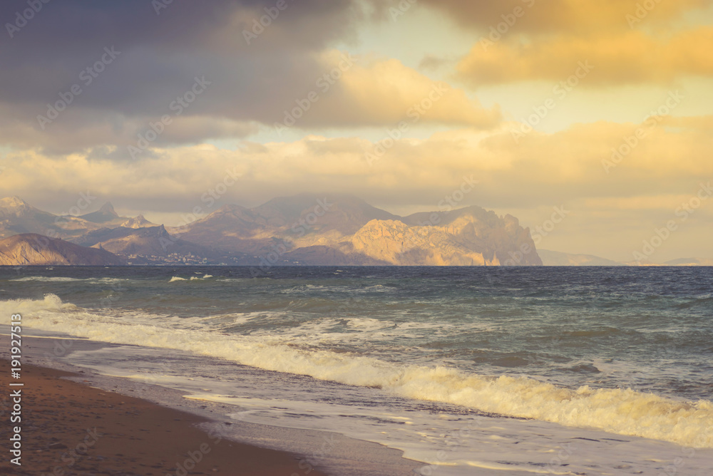 Fototapeta premium Seascape on a stormy sea on a mountain coast on a sunny day