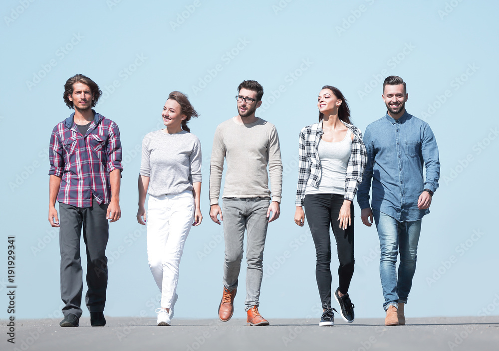 Fototapeta premium young people walking along the road.