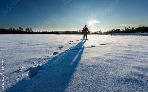 Man silhouette in tranquil winter landscape