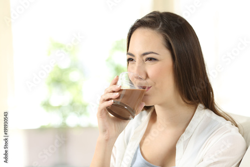 Woman drinking a cocoa shake