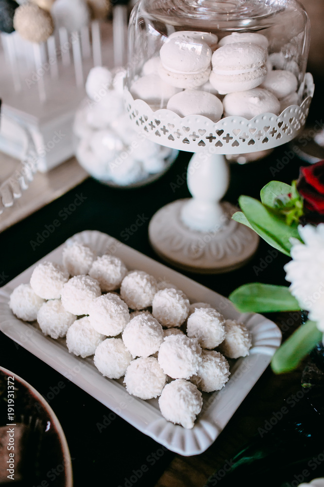 White Candy Bar. Delicious sweet buffet on the wedding. Arwork
