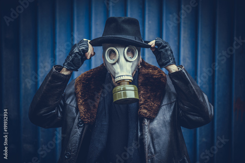 Fashionable man with gas mask on the head,selective focus © ltummy
