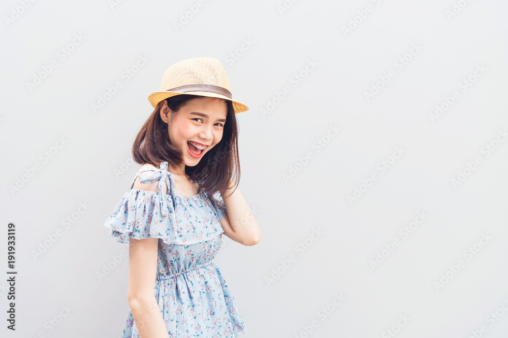 Young girl happy smile and cheerful in blue dress. Concept summer travel. Young girl happy smile and cheerful in blue dress. Concept summer travel.