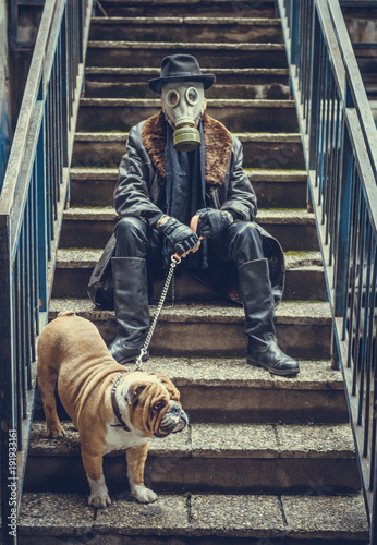 Man and English bulldog on the stairs,selective focus