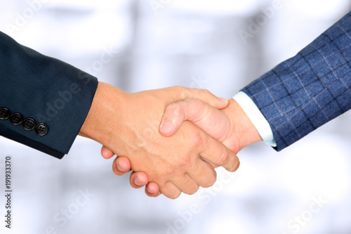 Successful business people shaking hands at the meeting