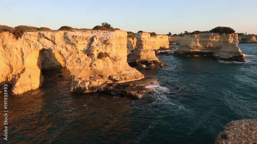 Sunrise seascape with cliffs, rocky arch and stacks (faraglioni), at Torre Sant Andrea, Salento sea coast, Puglia, Italy
Sunrise seascape with cliffs, rocky arch and stacks (faraglioni), at Torre Sant Andrea, Salento sea coast, Puglia, Italy
