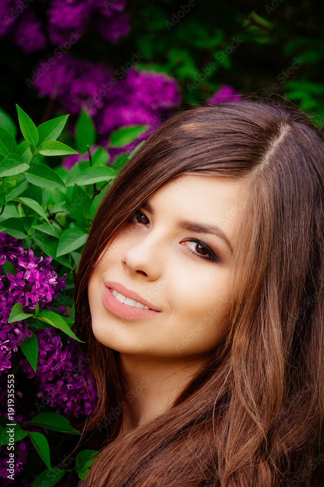 portrait of a young woman, beautiful girl face with flowers in spring portrait of a young woman, beautiful girl face with flowers in spring